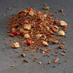 Chocolate Rooibos: Loose leaf rooibos tea with rooibos, organic honeybush, chocolate, banana bits, apple bits, cacao nibs, pink peppercorn